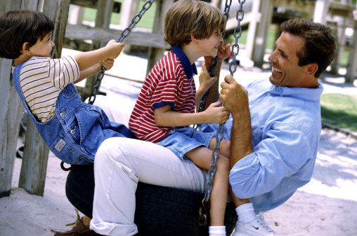 Man at park with his children