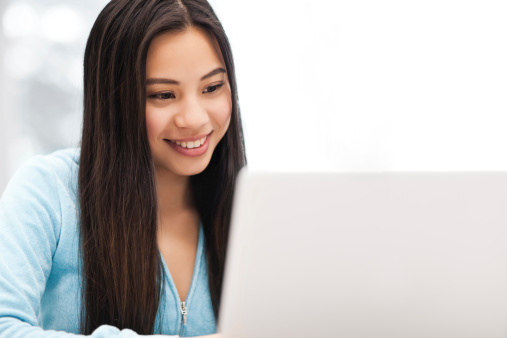 young woman writing resume
