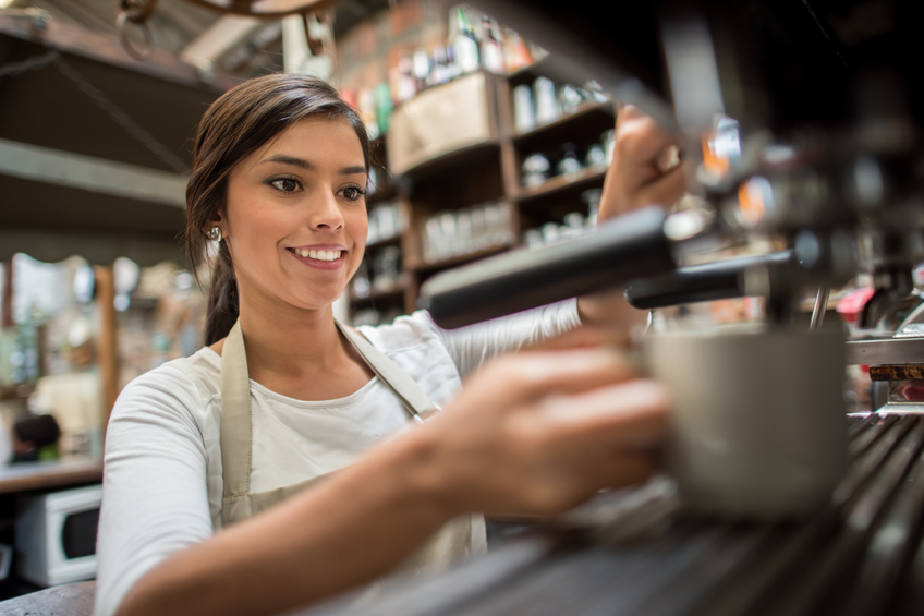 Woman making a cup of coffee