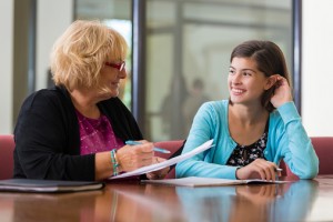 School counselor and student meeting