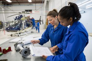 Women working on aircraft repair