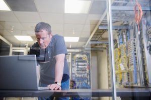 Man working on computer server