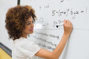 Female math student at whiteboard