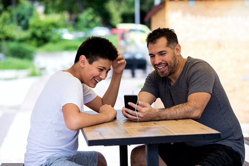 father and son talking