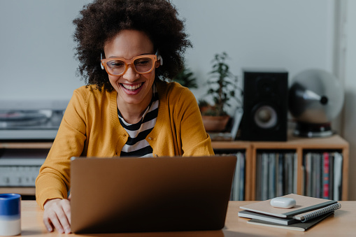 African American woman working on laptop