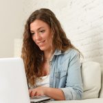 young woman using laptop computer