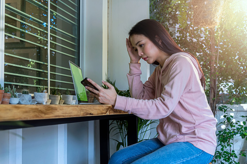 Worried young businesswoman