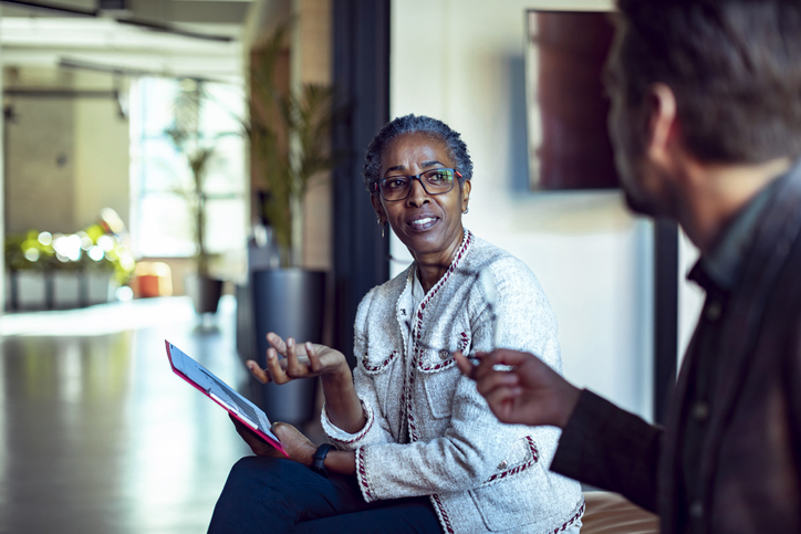 Black lady connecting with employee