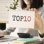 Top 10 text on notebook in hand business women