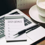 2025 goals list with laptop and coffee